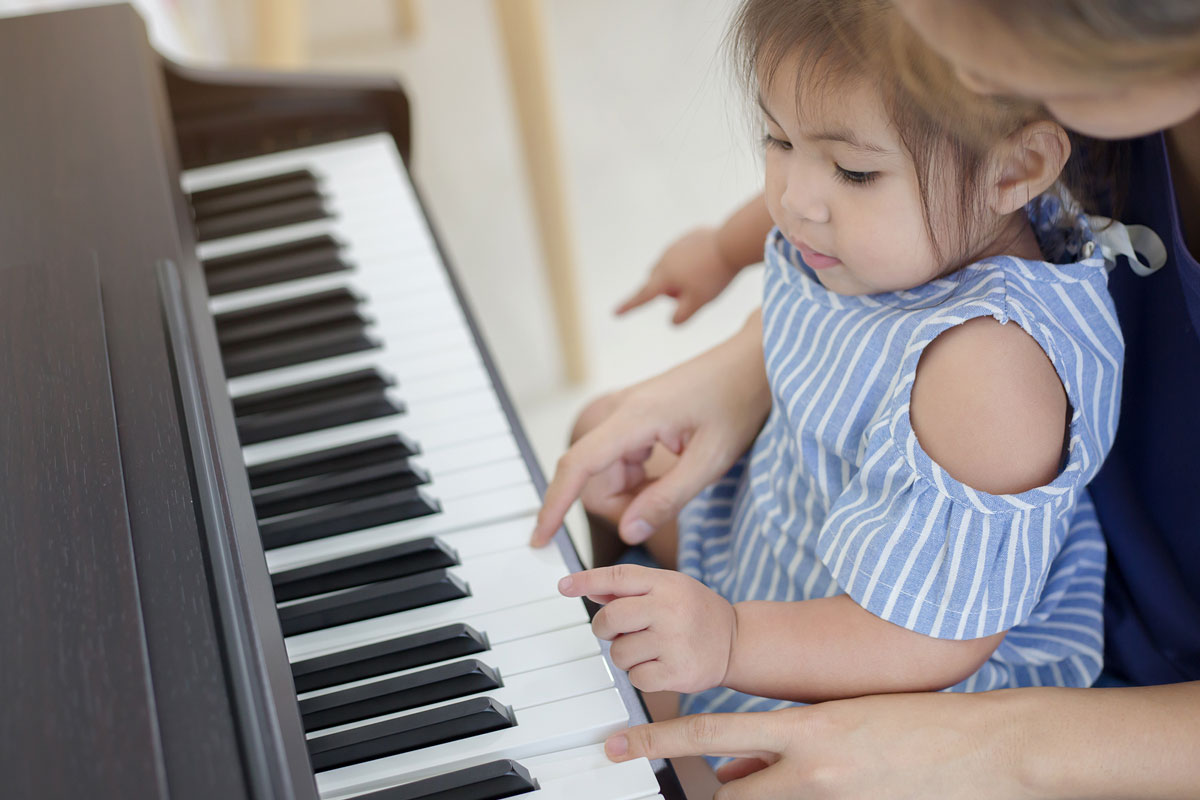 A baby playing piano