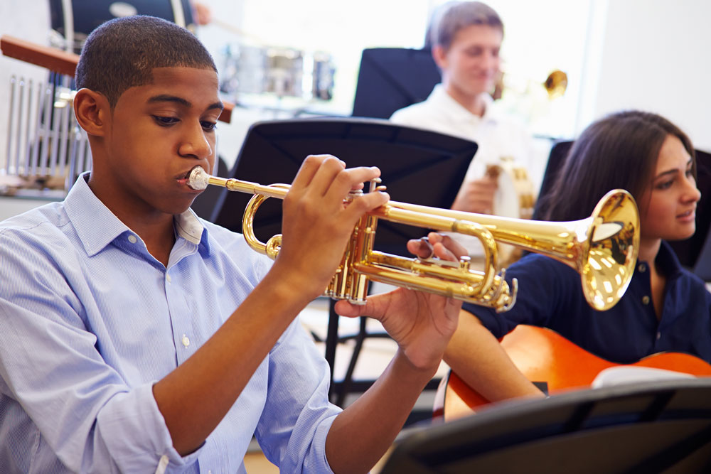 Teen during a music tutoring lesson