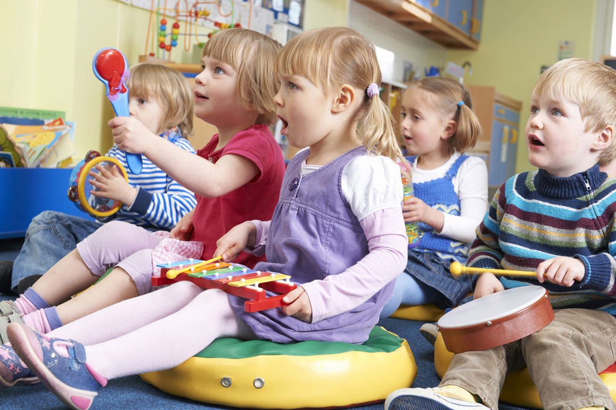 Toddlers playing musical toys